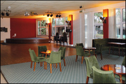 Photograph of the social club interior, looking toward the stage.
